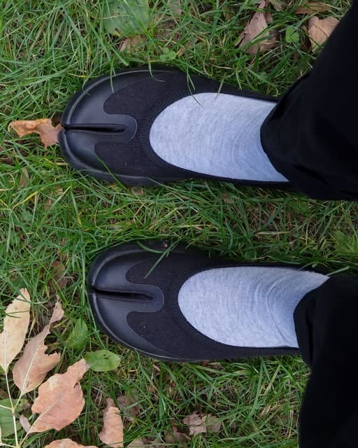 Tabi on grass, street photograph, london